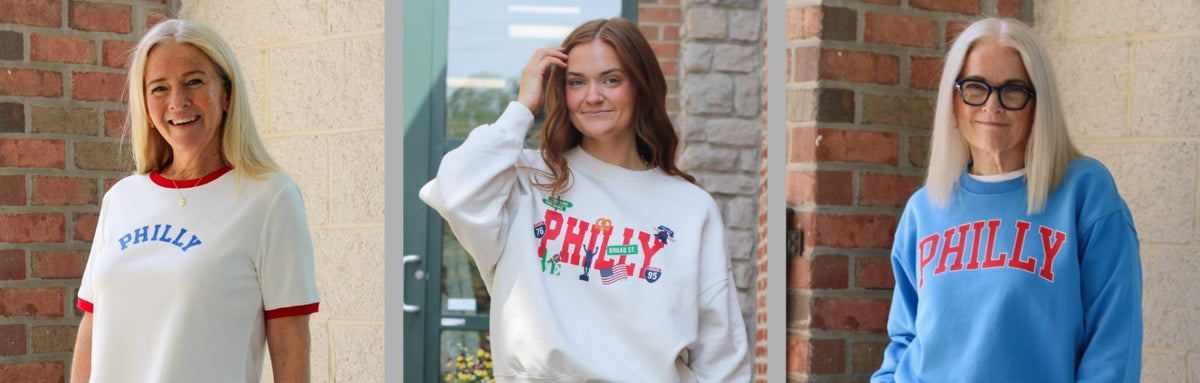 Women wearing Philly T-shirts and sweatshirts