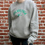 Cream heavyweight crewneck sweatshirt with green Philadelphia Eagles logo and established 1933 text