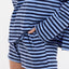 Person wearing a blue and white striped outfit