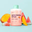 Watermelon Mango Shower Shake bottle with mint cap surrounded by fresh watermelon and mango fruit slices on light blue backg…