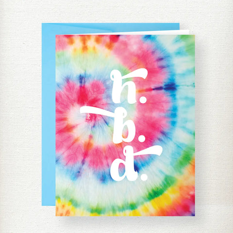 Colorful tie-dye birthday greeting card with white text reading 'h.b.d.' centered on vibrant rainbow spiral pattern