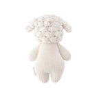 Knitted sheep toy with fluffy white head on a white background