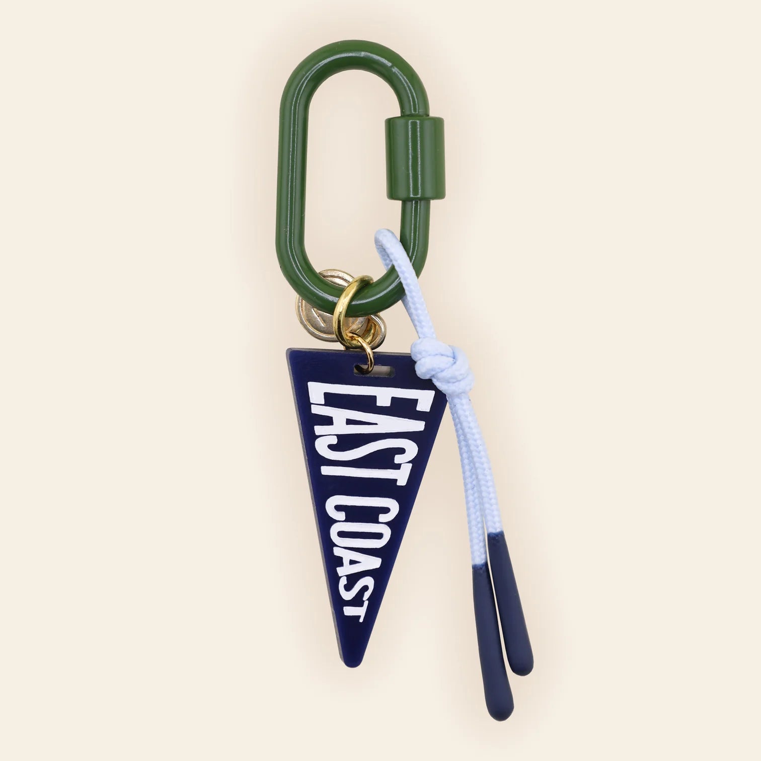 Navy East Coast pennant bag charm with white text, green carabiner, and light blue tassel attached to brass ring