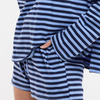 Person wearing a blue and white striped outfit 