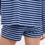Person wearing a blue and white striped outfit 
