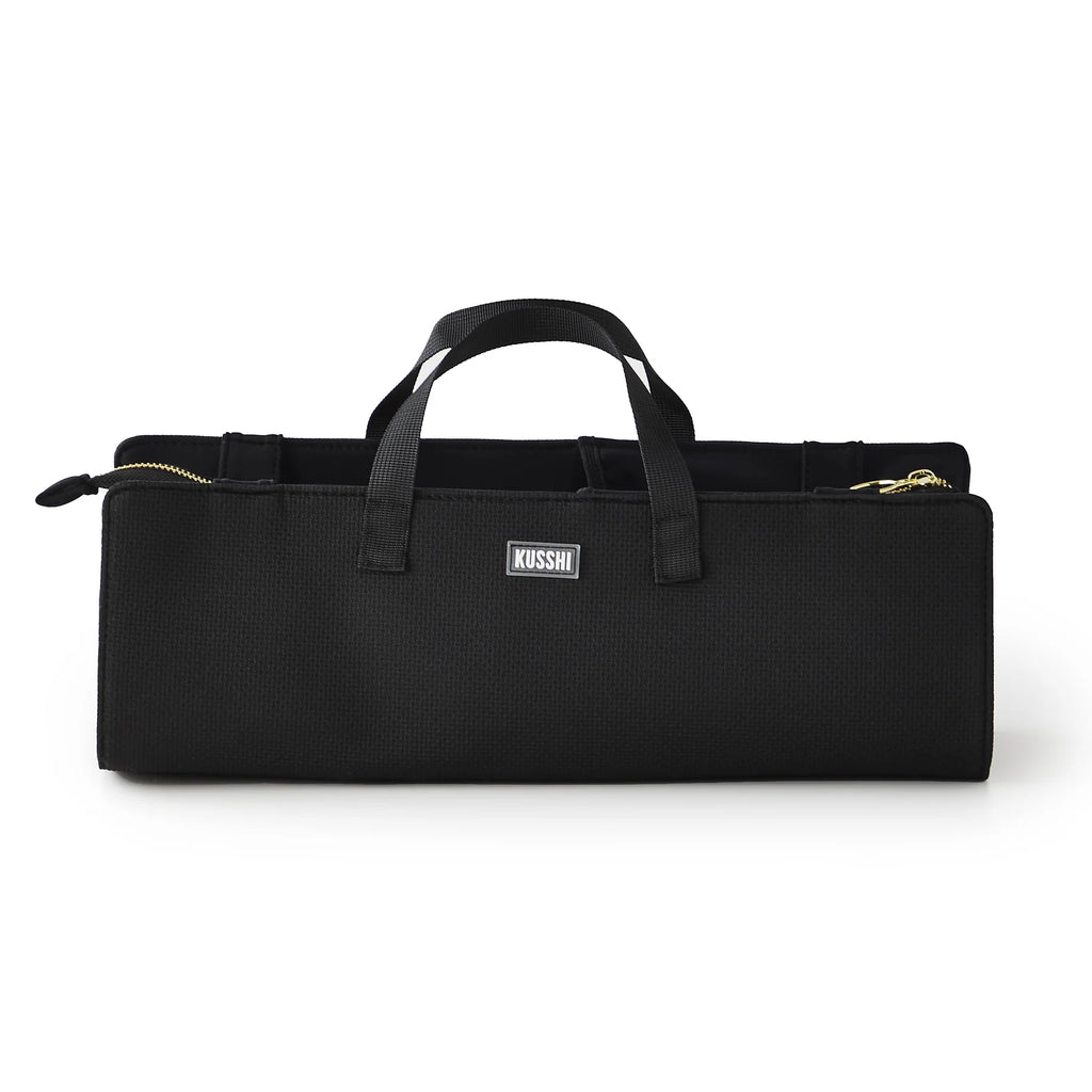 Kusshi black hair tools bag with dual handles and zippered compartments for organizing styling supplies