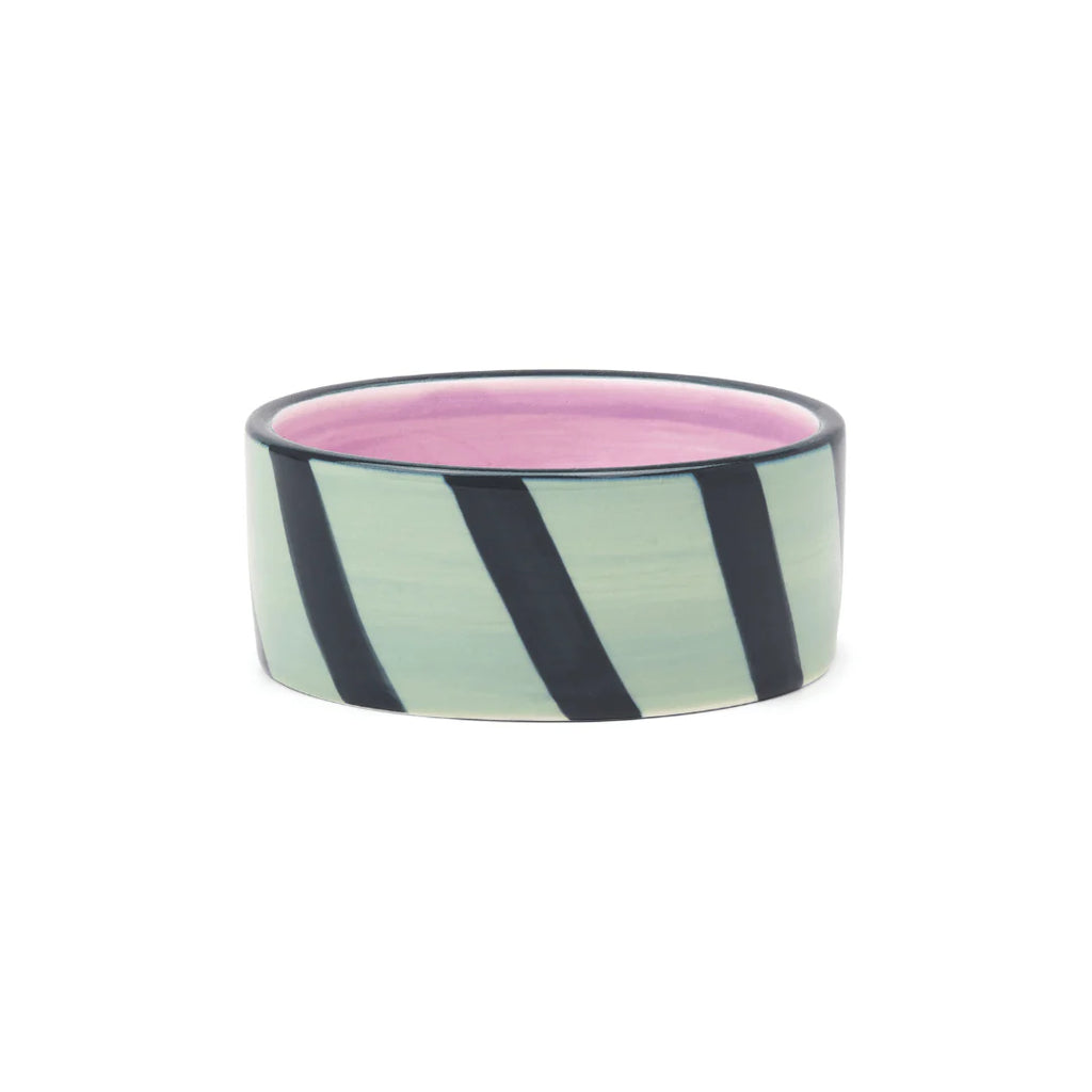 Izzy Wine Coaster with mint green and black diagonal stripes, pink interior, and dark rim