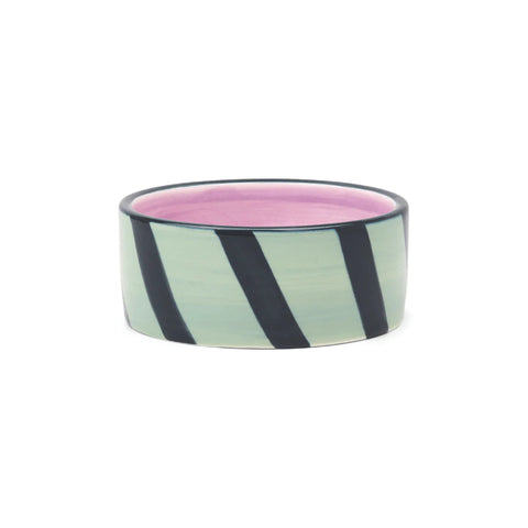 Izzy Wine Coaster with mint green and black diagonal stripes, pink interior, and dark rim
