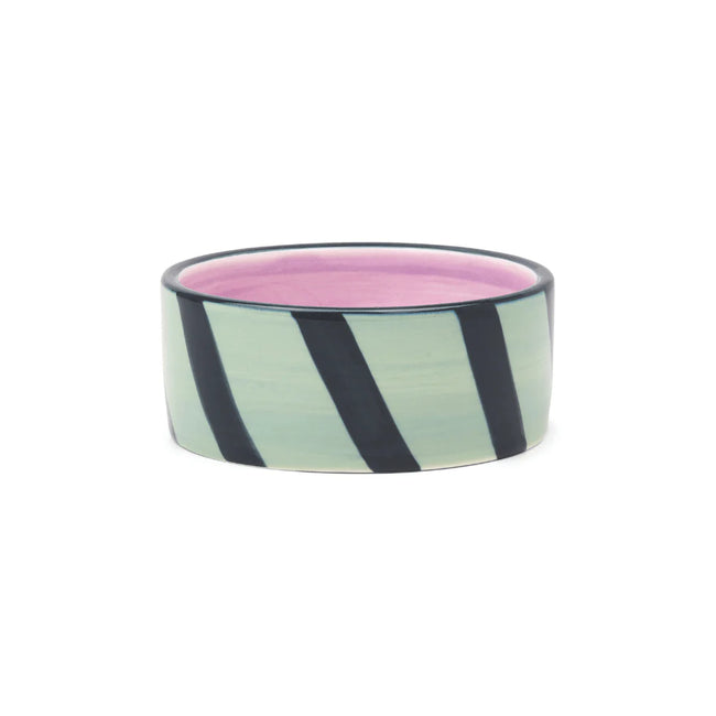 Izzy Wine Coaster with mint green and black diagonal stripes, pink interior, and dark rim Main image