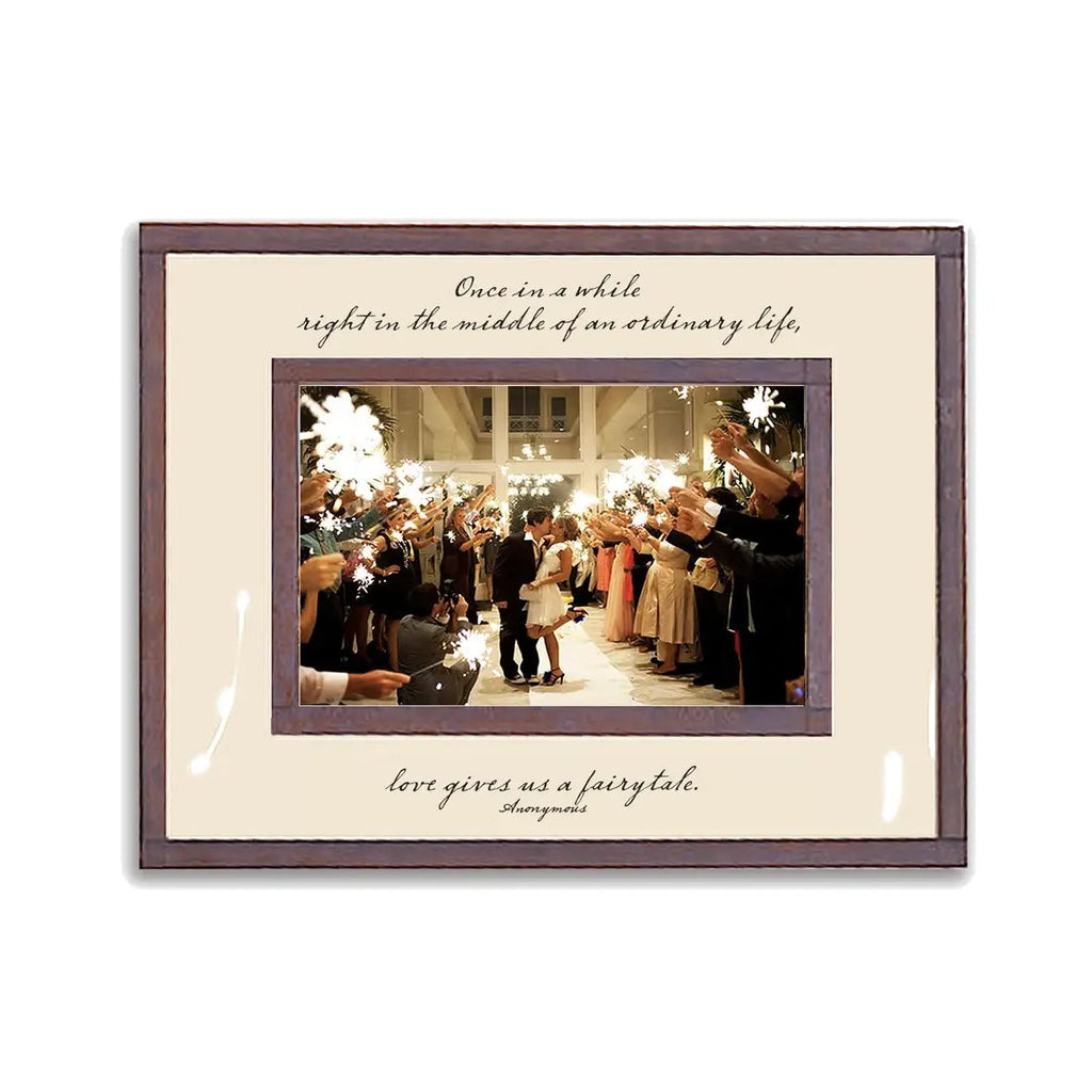 Framed wedding photo with sparkler exit and inspirational quote about love and fairytales