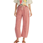 Woman wearing cream graphic tee and pink pinstriped wide-leg cropped pants with drawstring waist and side pockets