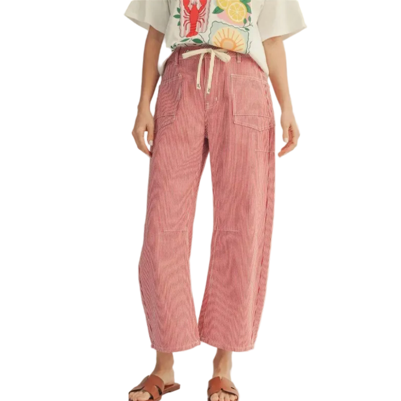 Woman wearing cream graphic tee and pink pinstriped wide-leg cropped pants with drawstring waist and side pockets