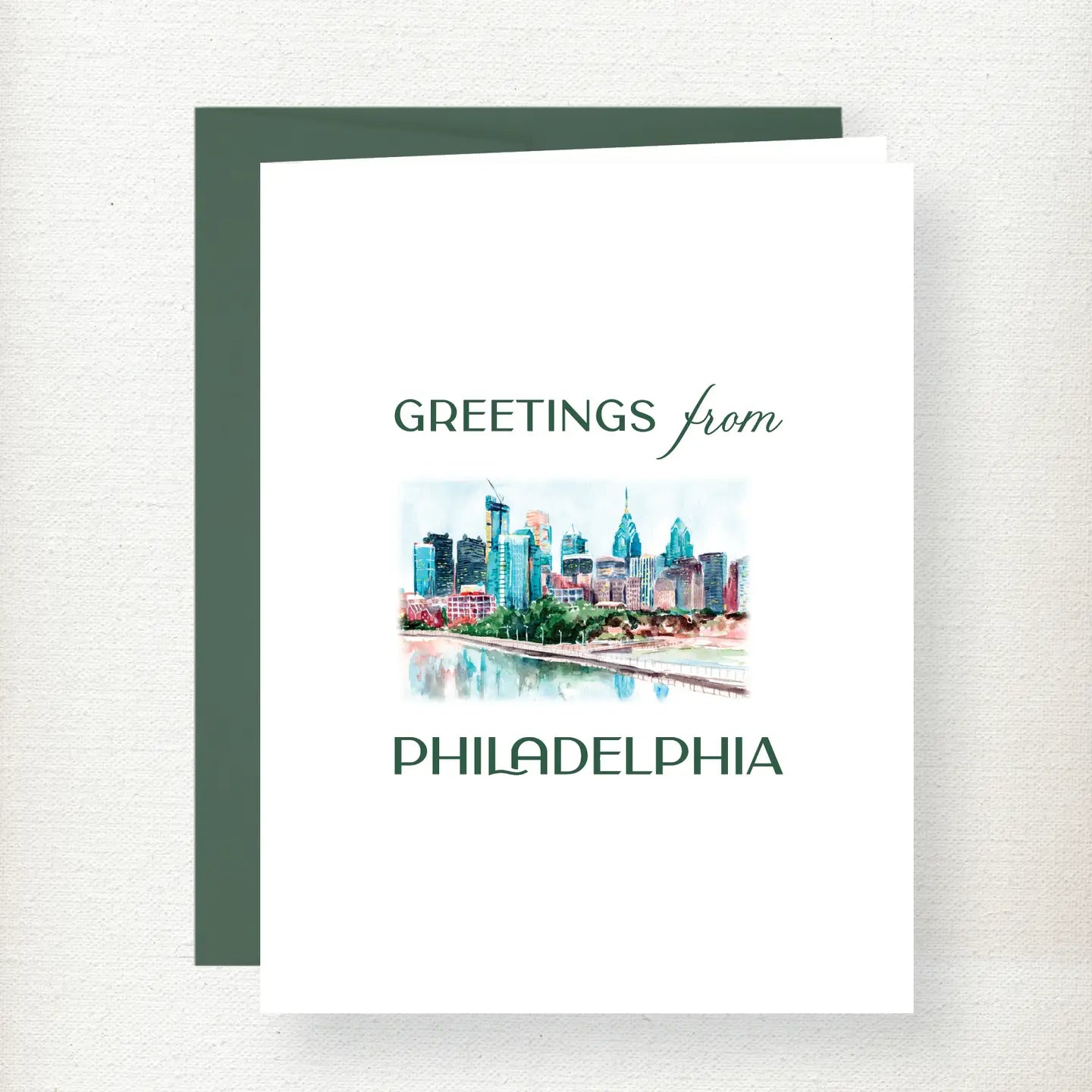 Greetings from Philadelphia skyline greeting card featuring watercolor illustration of iconic buildings and river with green… Main image