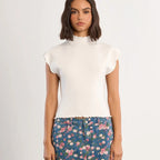 White ribbed ruffle sleeve tee with crew neckline paired with floral denim skirt