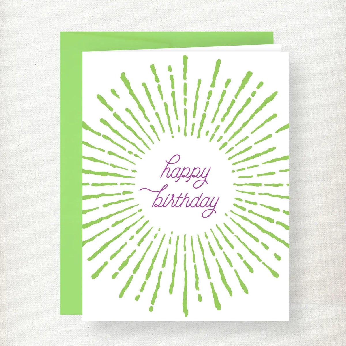 Sunburst Birthday Greeting Card with green radiating lines and purple happy birthday script text on white cardstock with gre…