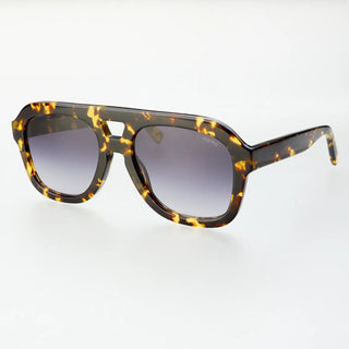 Yellow tortoise sunglasses against a white background. 